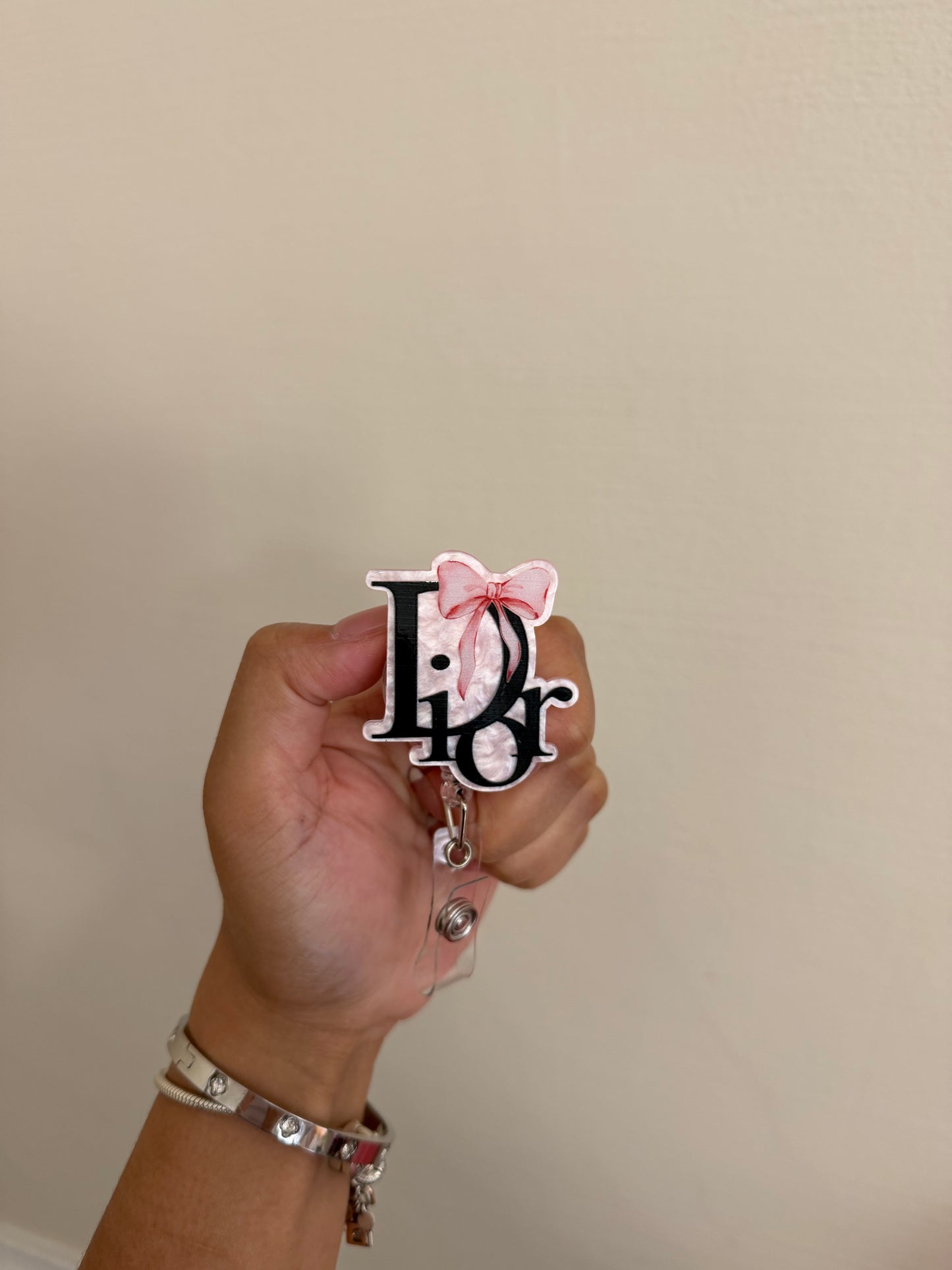 Dior badge reel