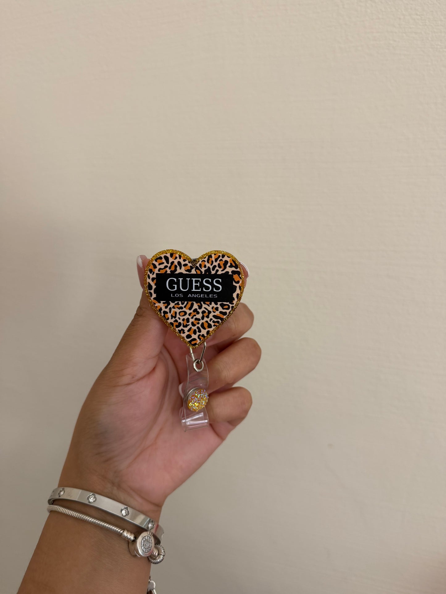 Guess badge reel
